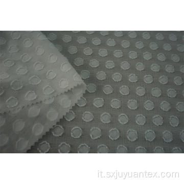 Tessuto jacquard con clip in poliestere a pois bruciato